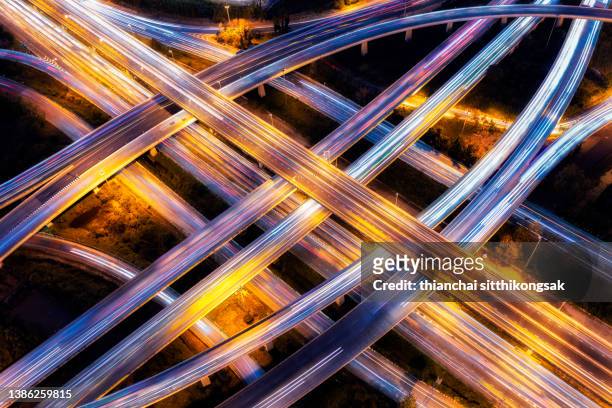 aerial view of traffic on bangkok highway night - smart street light stock pictures, royalty-free photos & images
