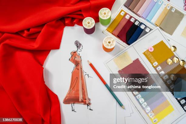 fashion designers working in the studio. - tailor stock-fotos und bilder