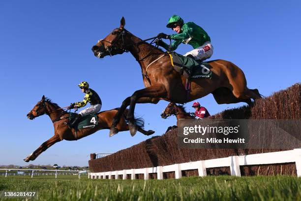 Daniel Jacob and Zambella jump the third last with Sam Coltherd and Maid O'Malley on day four of the Cheltenham Festival 2022 at Cheltenham...