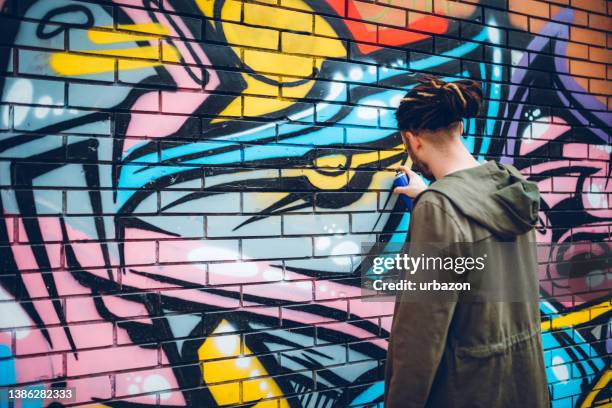 graffiti artist with dreadlocks - street artist stock pictures, royalty-free photos & images
