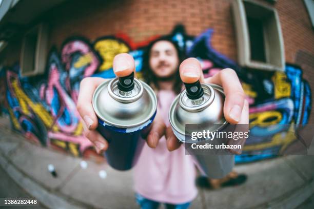 graffiti artist with dreadlocks - graffiti artist stock pictures, royalty-free photos & images