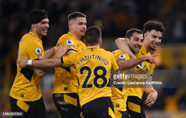 Jonny Otto of Wolverhampton Wanderers celebrates after scoring their side's first goal with team mates during the Premier League match between...