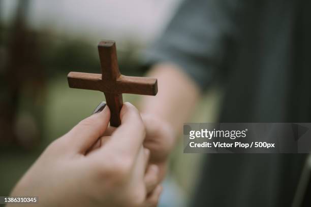 hand with cross,close-up of man holding cross - pastor stock pictures, royalty-free photos & images