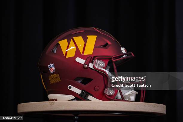 View of a Washington Commanders helmet on display during a press conference to introduce quarterback Carson Wentz at Inova Sports Performance Center...