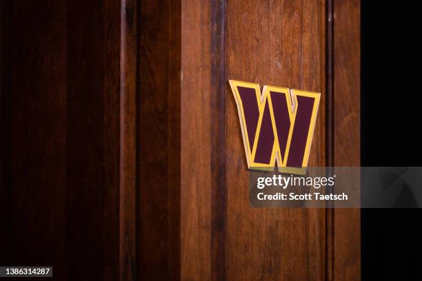 View of a Washington Commanders logo on display during a press conference to introduce quarterback Carson Wentz at Inova Sports Performance Center on...