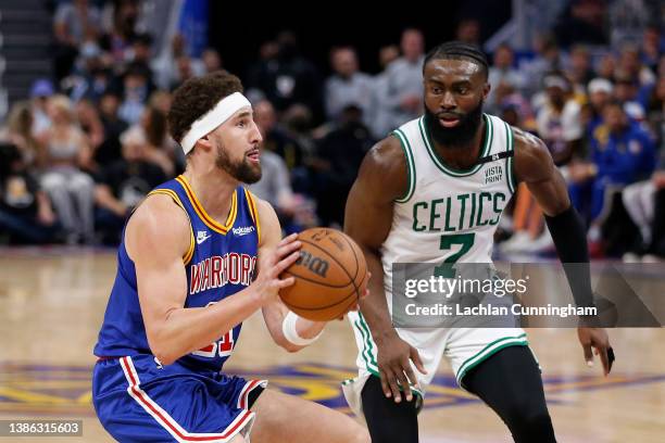 Klay Thompson of the Golden State Warriors pulls up to shoot the ball in the second quarter against Jaylen Brown of the Boston Celtics at Chase...