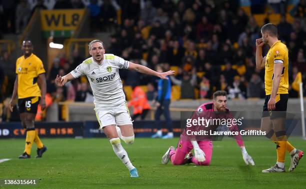 Luke Ayling of Leeds United celebrates after scoring their side's third goal during the Premier League match between Wolverhampton Wanderers and...