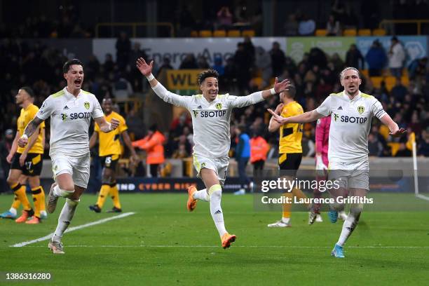 Luke Ayling of Leeds United celebrates after scoring their side's third goal with Robin Koch and Rodrigo Moreno during the Premier League match...