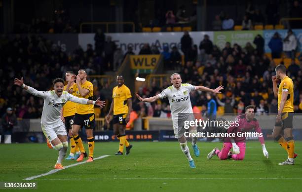 Luke Ayling of Leeds United celebrates with Rodrigo Moreno after scoring their side's third goal during the Premier League match between...