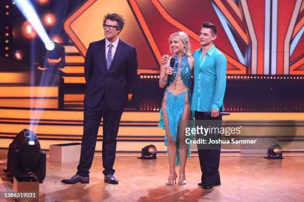 Daniel Hartwich, Janin Ullmann and Zsolt Sandor Cseke are seen on stage during the 4th show of the 15th season of the television competition show...