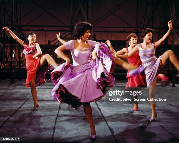 Rita Moreno, Puerto Rican actress, singer and dancer, wearing a short-sleeved lilac dress, dancing in a publicity image issued for the film...