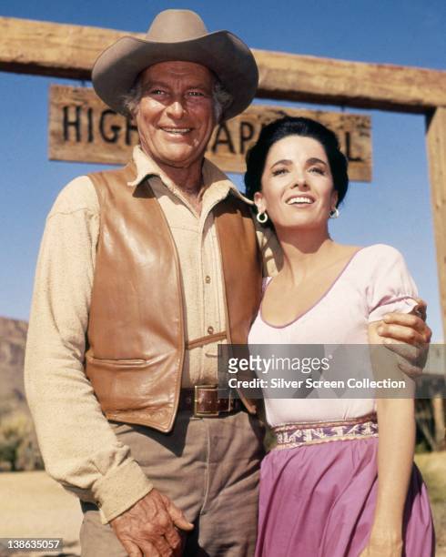 Leif Erickson , US actor, and Linda Cristal, Argentinian actress, both in costume in a smiling in a portrait issued as publicity for the US...