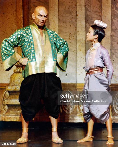 Yul Brynner , Russian-born US actor, in costume in a publicity still issued for the film, 'The King and I', 1956. The musical, directed by Walter...