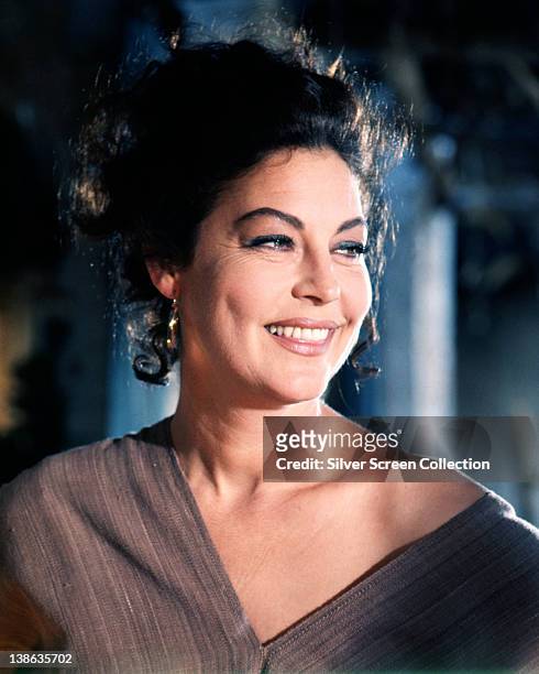 Ava Gardner , US actress, smiling with her head turned to her left in a studio portrait, circa 1970.
