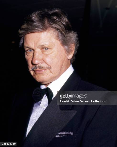 Charles Bronson , US actor, wearing a dinner jacket and bow tie, circa 1985.