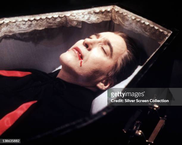 Christopher Lee, British actor, blood trickling from his mouth as lays in a coffin in a publicity still issued for the film, 'Dracula', 1958. The...