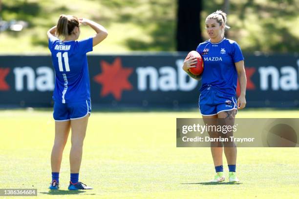 Daisy Bateman and Sophie Abbatangelo of North Melbourne chat before the AFLW Qualifying Final match between North Melbourne Kangaroos and Fremantle...