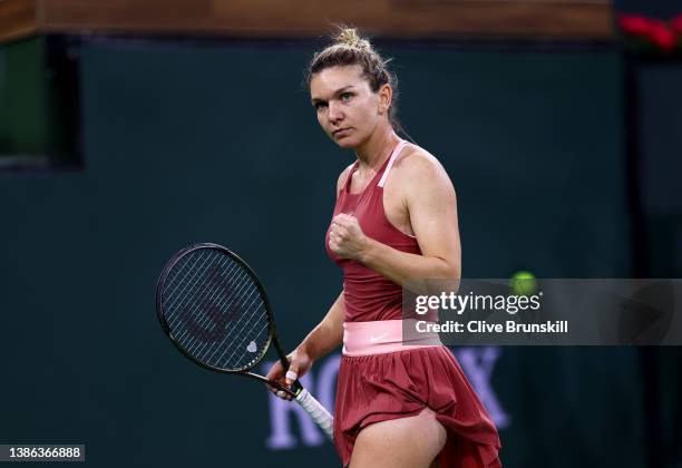 Simona Halep of Romania celebrates a point against Iga Swiatek of Poland in their semifinal match on Day 12 of the BNP Paribas Open at the Indian...