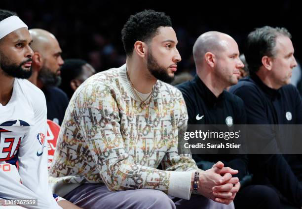 Ben Simmons of the Brooklyn Nets looks on from the bench during the first half against the Portland Trail Blazers at Barclays Center on March 18,...