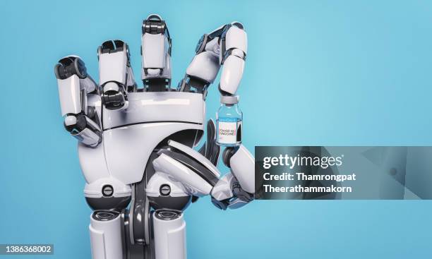 robotic arm is holding a bottle of a new strain of coronavirus vaccine for non-immune patients. innovative technology and healthcare concept. 3d illustration rendering - robot arm human arm stock pictures, royalty-free photos & images