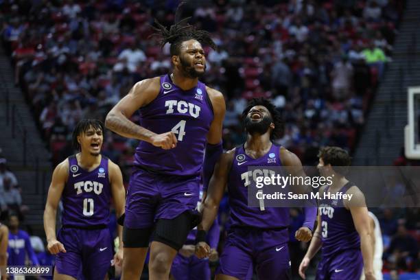 Eddie Lampkin and Mike Miles of the TCU Horned Frogs react against the Seton Hall Pirates during the first half in the first round game of the 2022...
