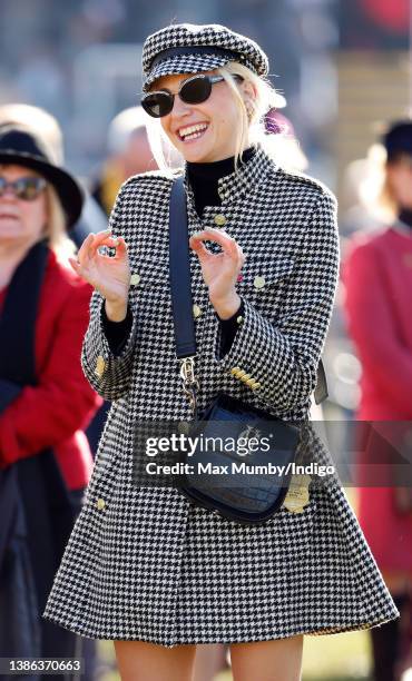 Pixie Lott watches the racing as she attends day 4 'Gold Cup Day' of the Cheltenham Festival at Cheltenham Racecourse on March 18, 2022 in...