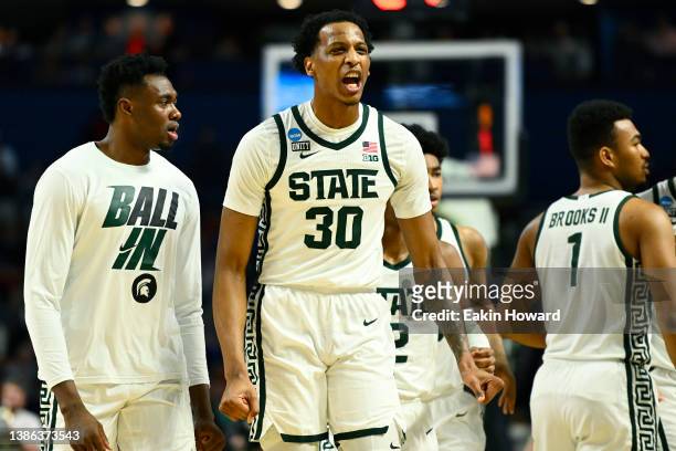 Marcus Bingham Jr. #30 of the Michigan State Spartans celebrates after a called timeout by the Davidson Wildcats during the second half in the first...