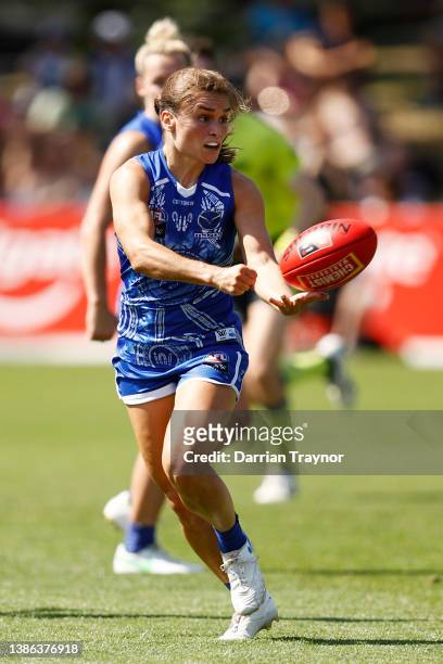Ashleigh Riddell of North Melbourne handballs during the AFLW Qualifying Final match between North Melbourne Kangaroos and Fremantle Dockers at Arden...