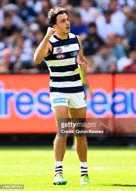 Brad Close of the Cats celebrates kicking a goal during the round one AFL match between the Geelong Cats and the Essendon Bombers at Melbourne...