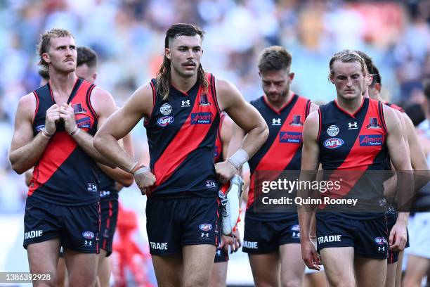 The Bombers look dejected after losing the round one AFL match between the Geelong Cats and the Essendon Bombers at Melbourne Cricket Ground on March...