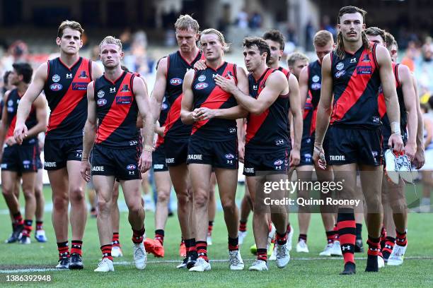 The Bombers look dejected after losing the round one AFL match between the Geelong Cats and the Essendon Bombers at Melbourne Cricket Ground on March...