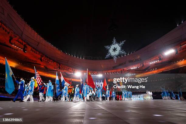 Flag bearers are seen during the Closing Ceremony on day nine of the 2022 Beijing Winter Paralympics at Beijing National Stadium on March 13, 2022 in...