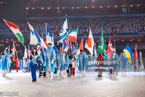 Flag bearers are seen during the Closing Ceremony on day nine of the 2022 Beijing Winter Paralympics at Beijing National Stadium on March 13, 2022 in...