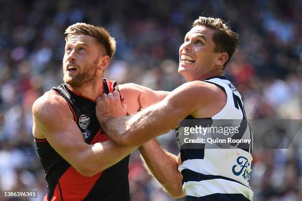 Jayden Laverde of the Bombers and Tom Hawkins of the Cats compete for a mark during the round one AFL match between the Geelong Cats and the Essendon...