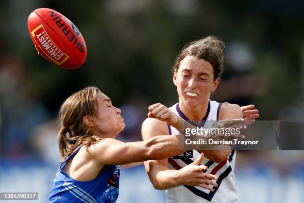 Ashleigh Riddell of North Melbourne tackles Jessica Low of Fremantle during the AFLW Qualifying Final match between North Melbourne Kangaroos and...