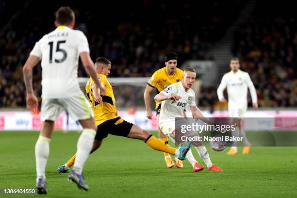 Adam Forshaw of Leeds United clears the ball during the Premier League match between Wolverhampton Wanderers and Leeds United at Molineux on March...