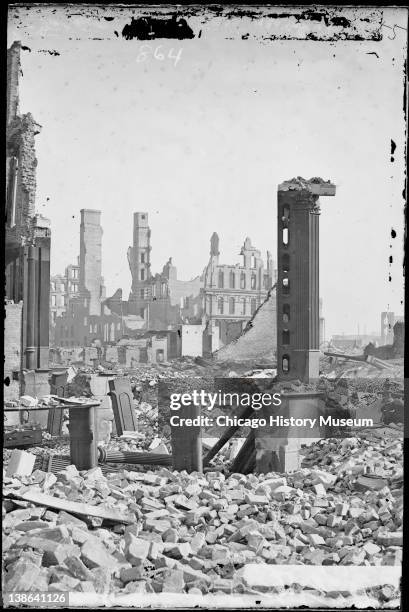 View from southwest corner of Dearborn and Monroe Streets, showing the Grand Pacific Hotel in the background and the ruins of the Honore Block in the...