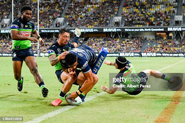 Murray Taulagi of the Cowboys scores a try during the round two NRL match between the North Queensland Cowboys and the Canberra Raiders at Qld...