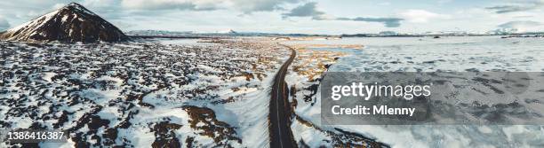 iceland mývatn country road panorama frozen lake myvatn in winter - myvatn stock pictures, royalty-free photos & images