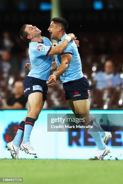 Lalakai Foketi of the Waratahs celebrates with team mate Will Harrison of the Waratahs after scoring a try during the round five Super Rugby Pacific...