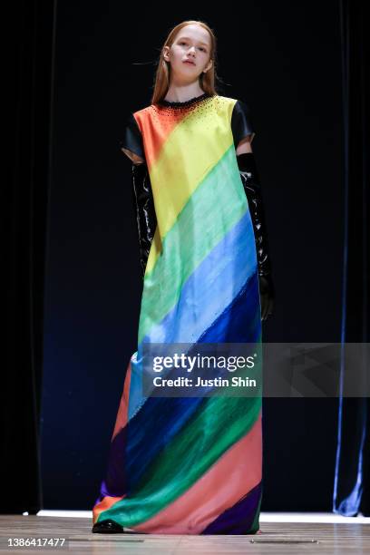 In this image released on March 21, a model showcases designs by HANACHA STUDIO in a prerecorded runway show as a part of Seoul Fashion Week 2022 AW...