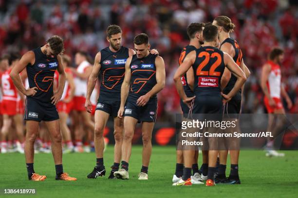 Callan Ward of the Giants talks to Stephen Coniglio of the Giants after losing the round one AFL match between the Greater Western Sydney Giants and...