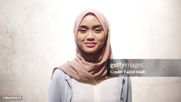 asian happy women hijab - indonesian ethnicity stock pictures, royalty-free photos & images