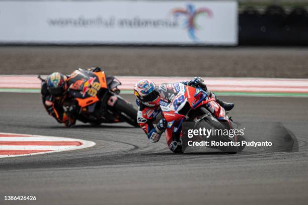 MotoGP rider Jorge Martin of Spain and Pramac Racing leads to MotoGP rider Brad Binder of South Africa and Red Bull KTM Factory Racing during the...