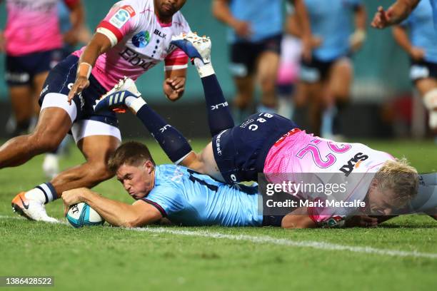 Alex Newsome of the Waratahs scores a try during the round five Super Rugby Pacific match between the NSW Waratahs and the Melbourne Rebels at Sydney...