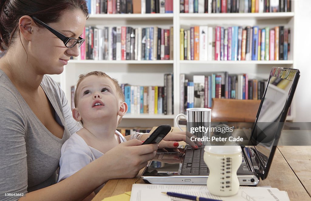 Mother working/studying with baby