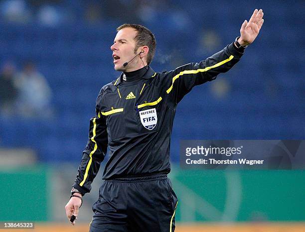 Referee Marco Fritz gestures during the DFB Cup Quarter Final match between TSG 1899 Hoffenheim and SpVgg Greuther Fuerth at Rhein-Neckar-Arena on...