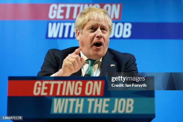 British Prime Minister Boris Johnson addresses delegates during the Conservative Party Spring Conference at Blackpool Winter Gardens on March 19,...