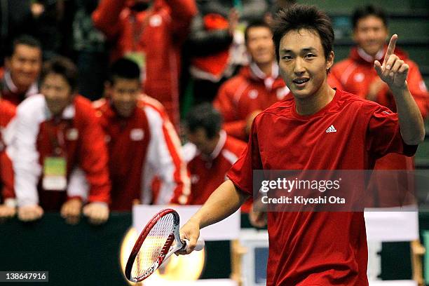 Go Soeda of Japan celebrates after winning his singles match against Ivan Dodig of Croatia during day one of the Davis Cup World Group 1st Round...