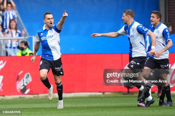 Gonzalo Escalante of Deportivo Alaves celebrates with teammates after scoring their team's first goal during the LaLiga Santander match between...